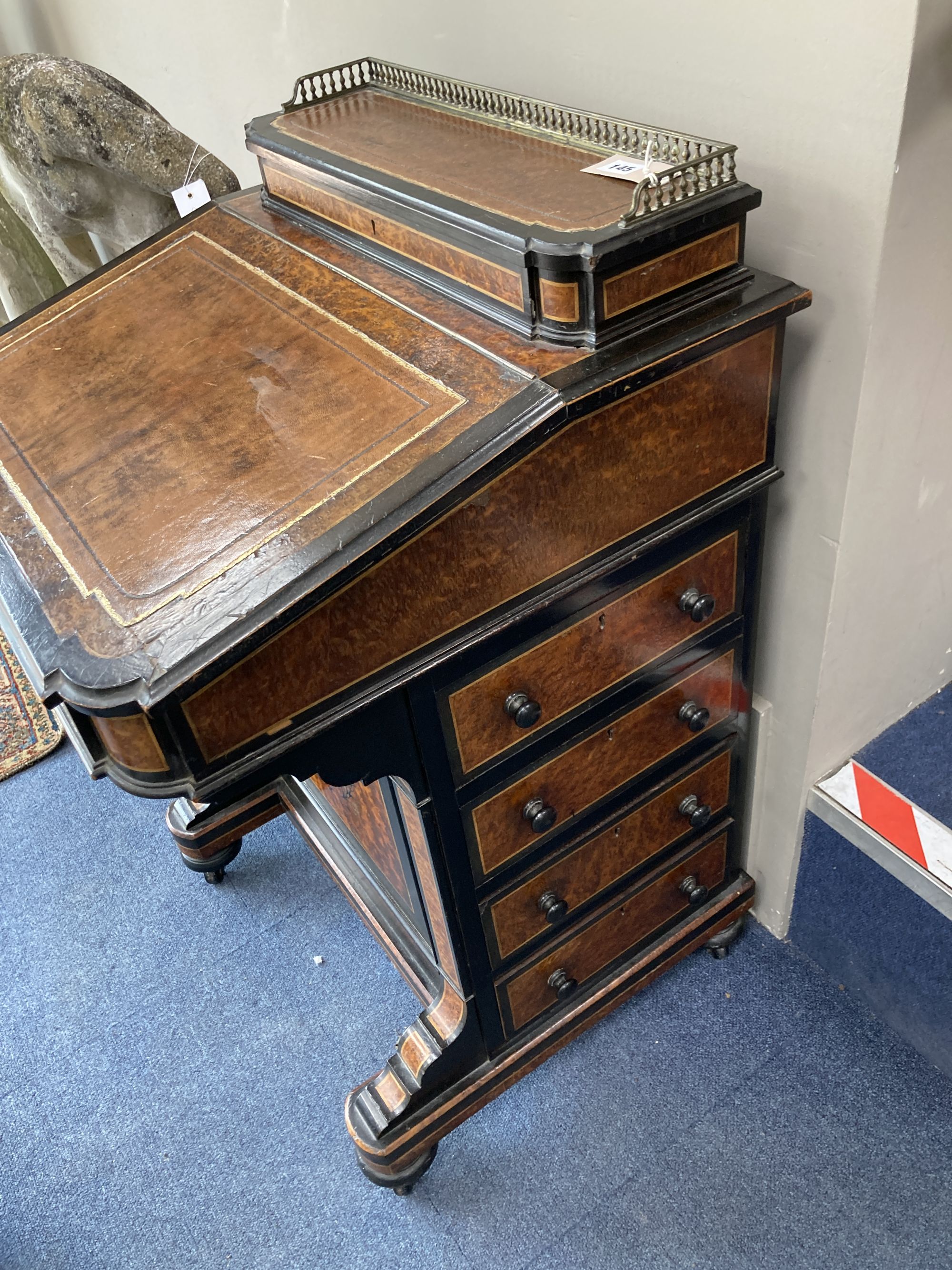 A Victorian ebonised and amboyna Davenport, width 56cm, depth 57cm, height 90cm
